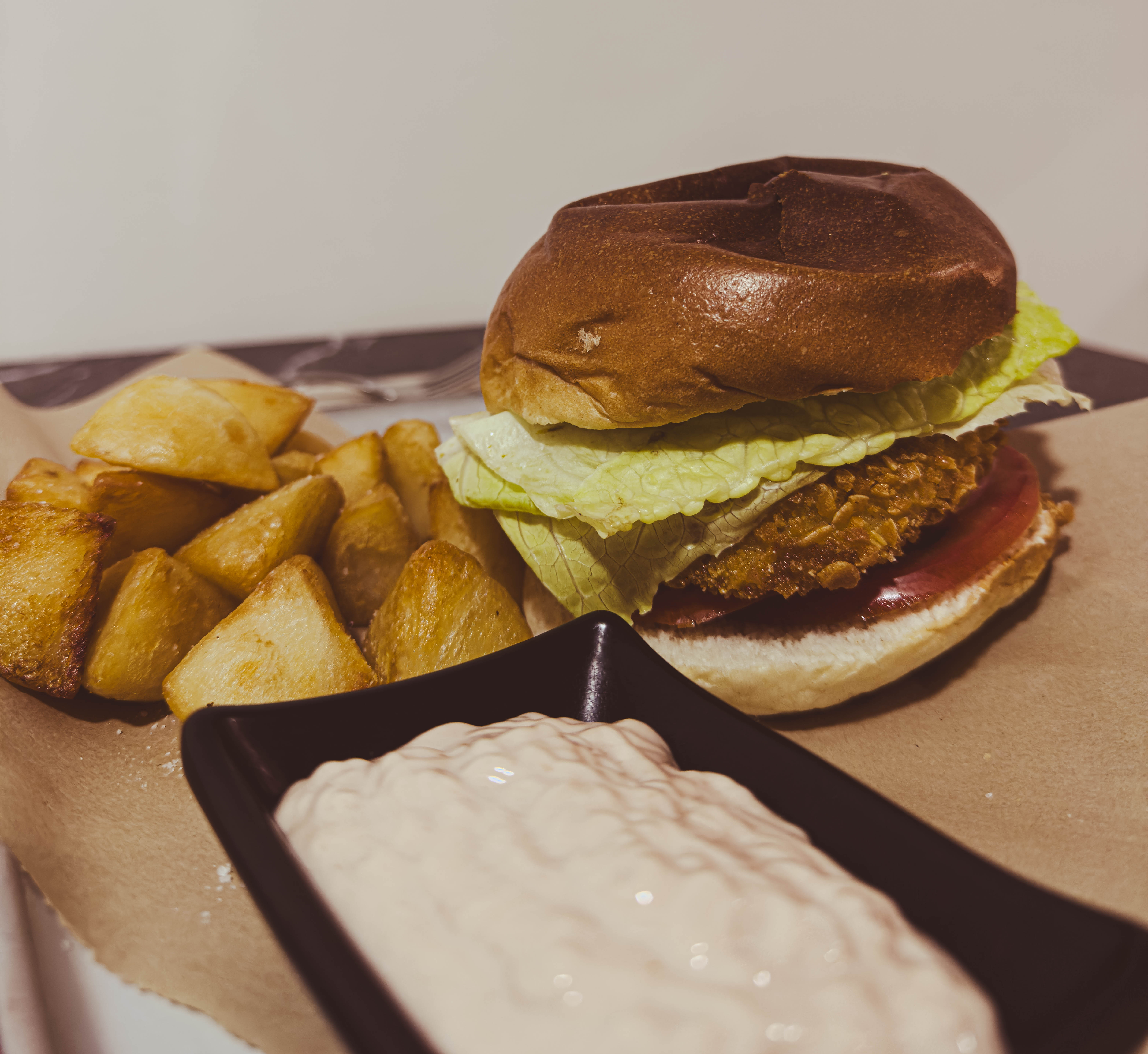 Vegan burger and potatoes